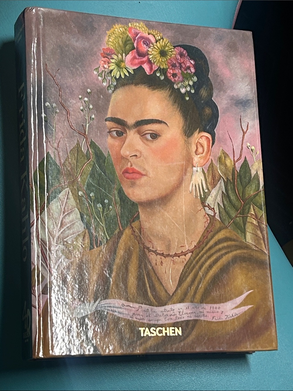 TASCHEN Frida Kahlo Portrait Book hardcover Pink, Green & Brown Cover